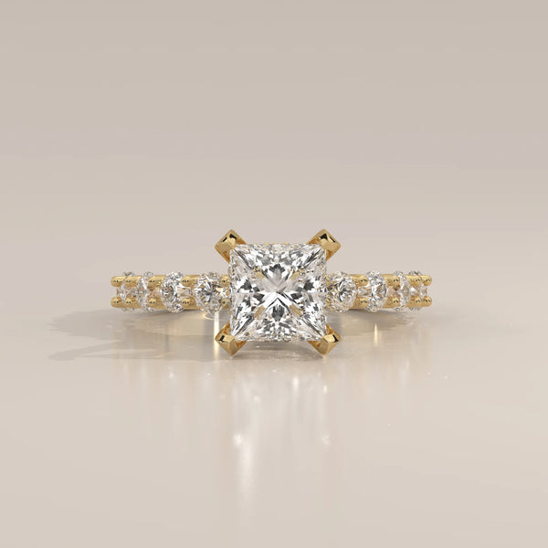 Princess Lab Grown Diamond Ring with Shared Claw Round Band in yellow gold, shown from the front.