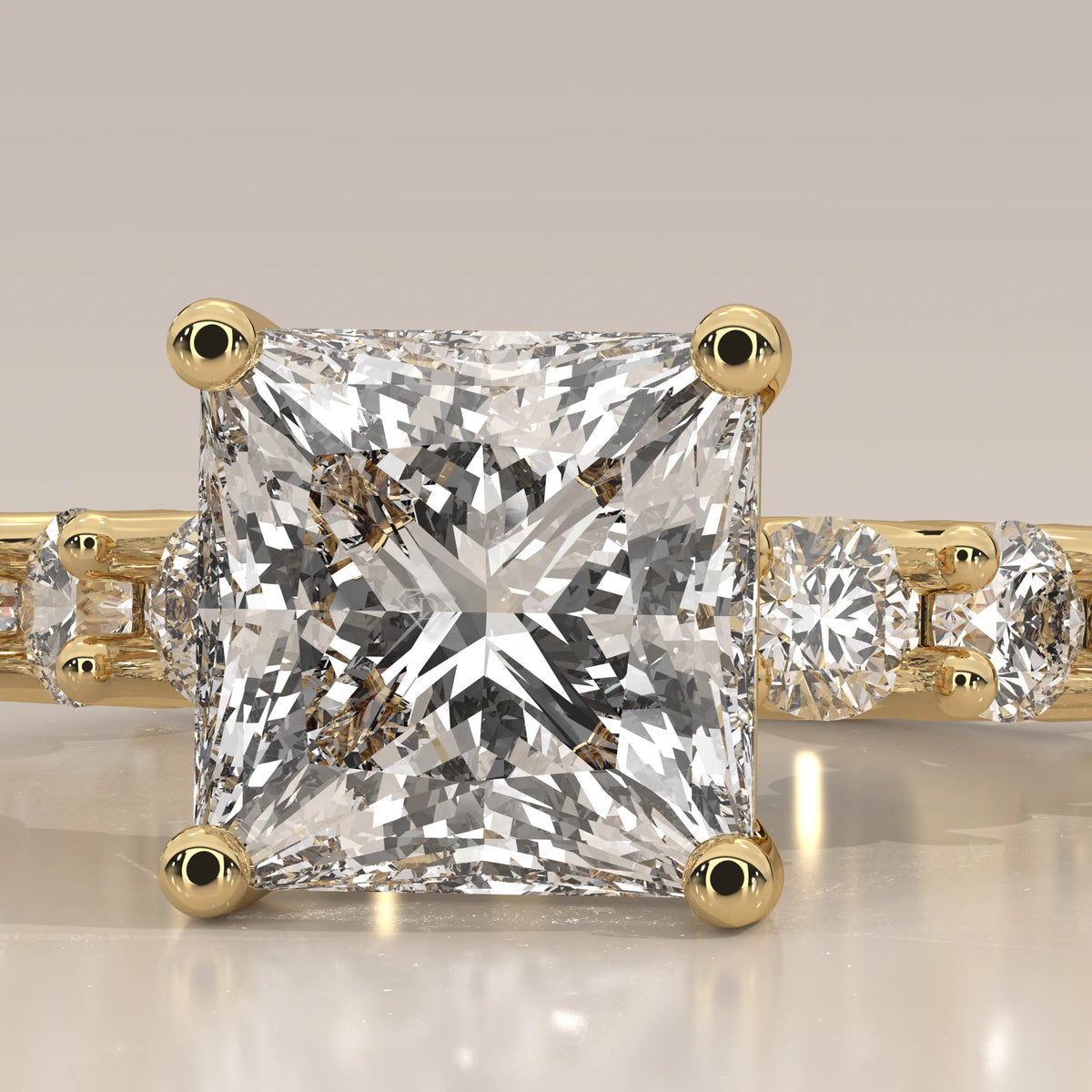 Princess Lab Grown Diamond Ring with Raised Claw Set Round Band in yellow gold, front view on a plain background.
