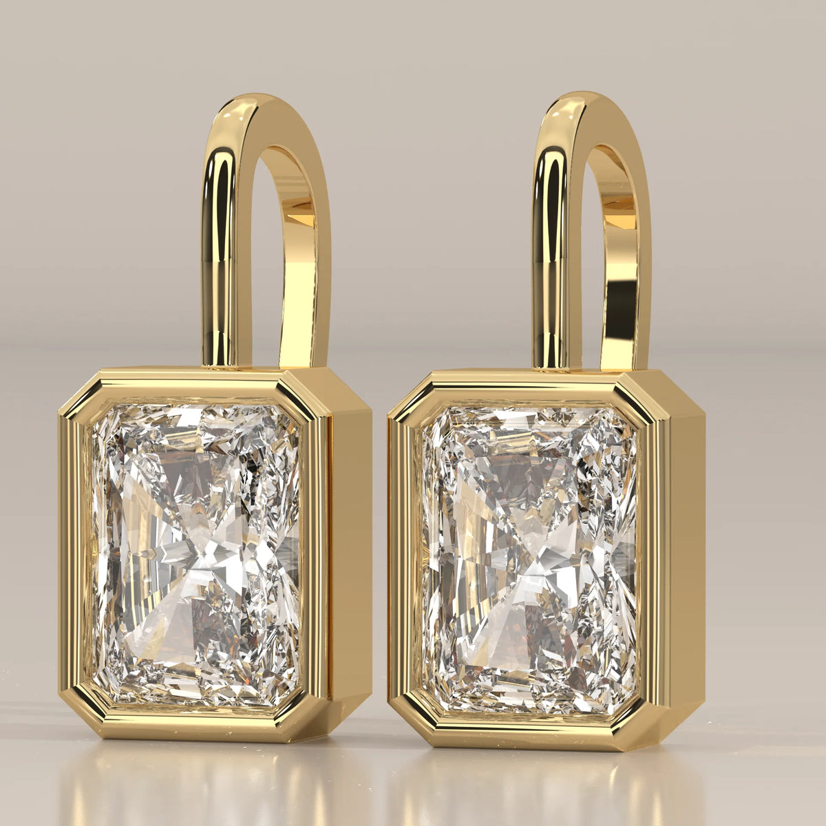 Radiant Cut Bezel Lab Grown Diamond Drop Earrings on Gold Hook in yellow gold, shown on a plain background.