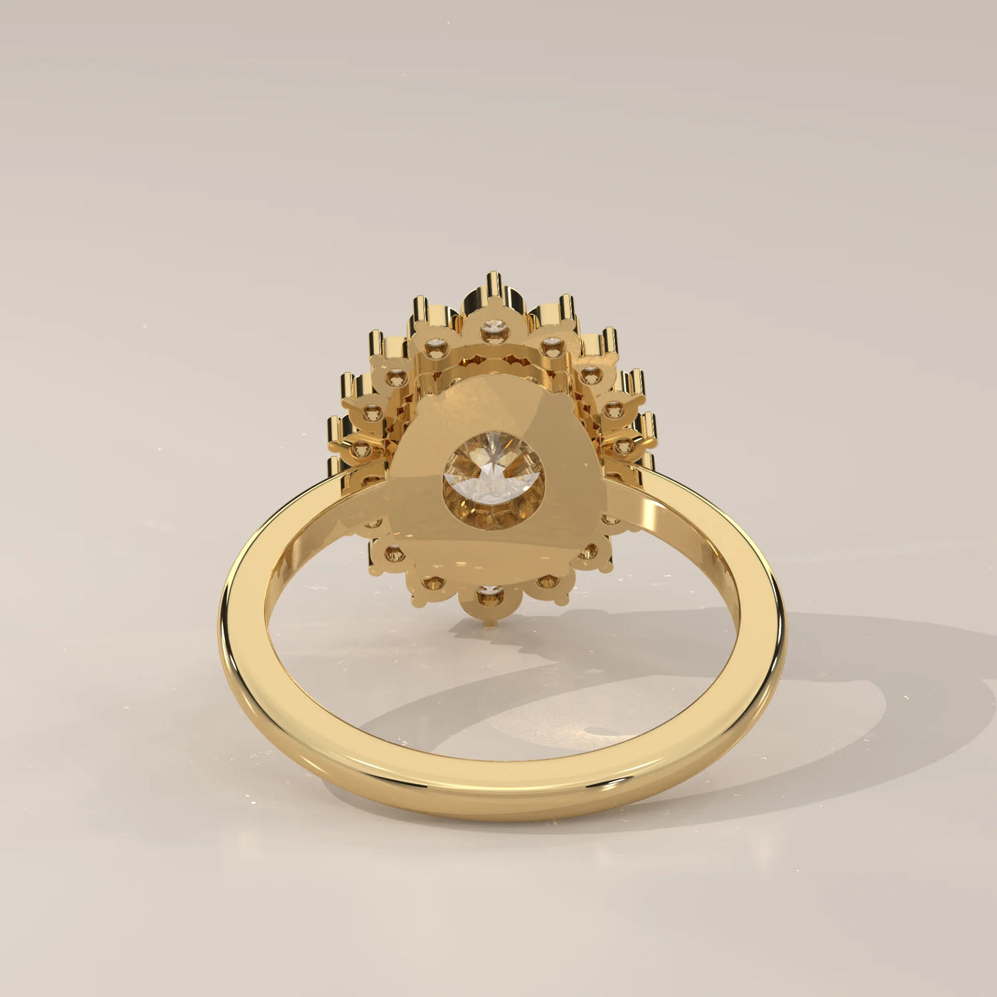Gold ring with a central diamond surrounded by smaller diamonds.