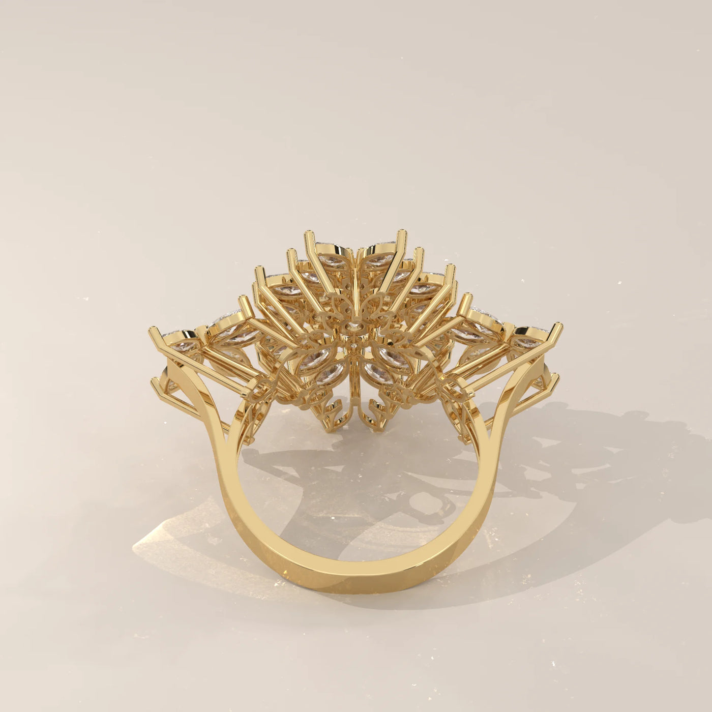 A yellow gold ring with a cluster of sparkling diamonds in a floral design.