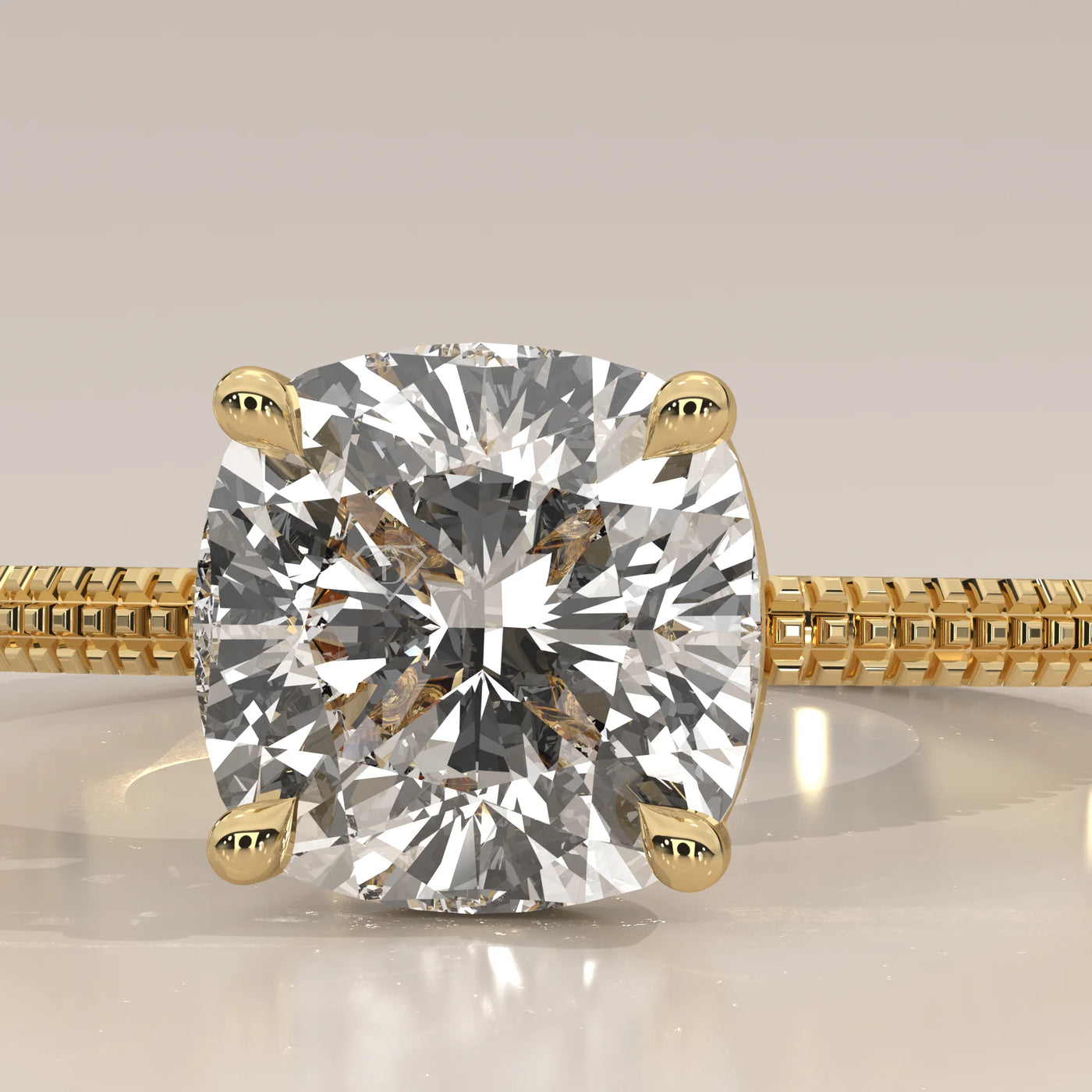 Gold ring with a large cushion-cut diamond in a bezel setting.