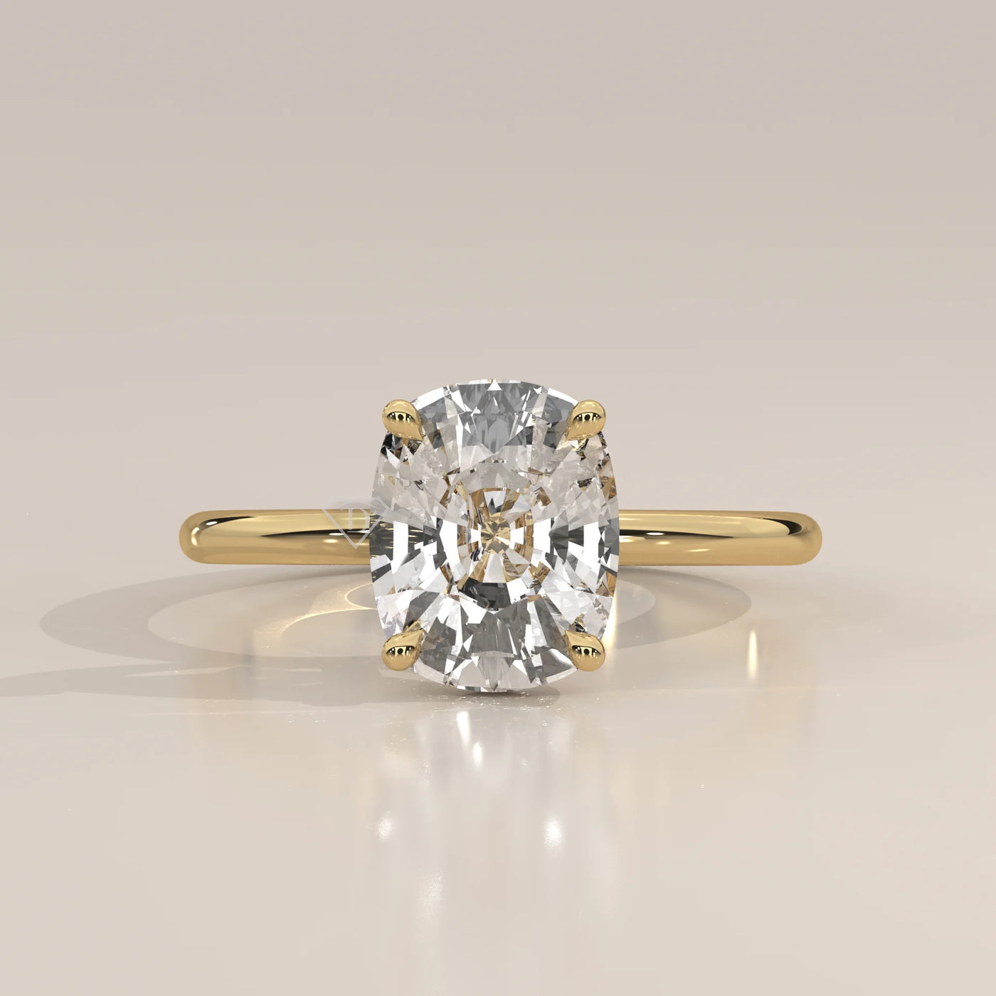 A cushion-cut diamond engagement ring in 14k yellow gold with pavé band.