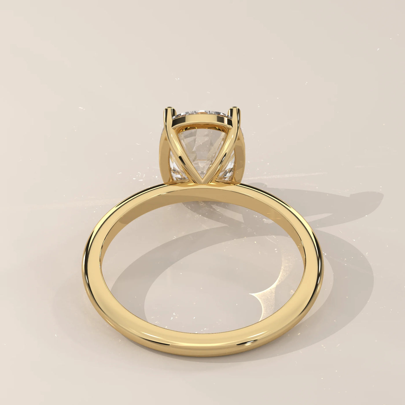 Yellow gold ring with a cushion-cut diamond and beaded band.