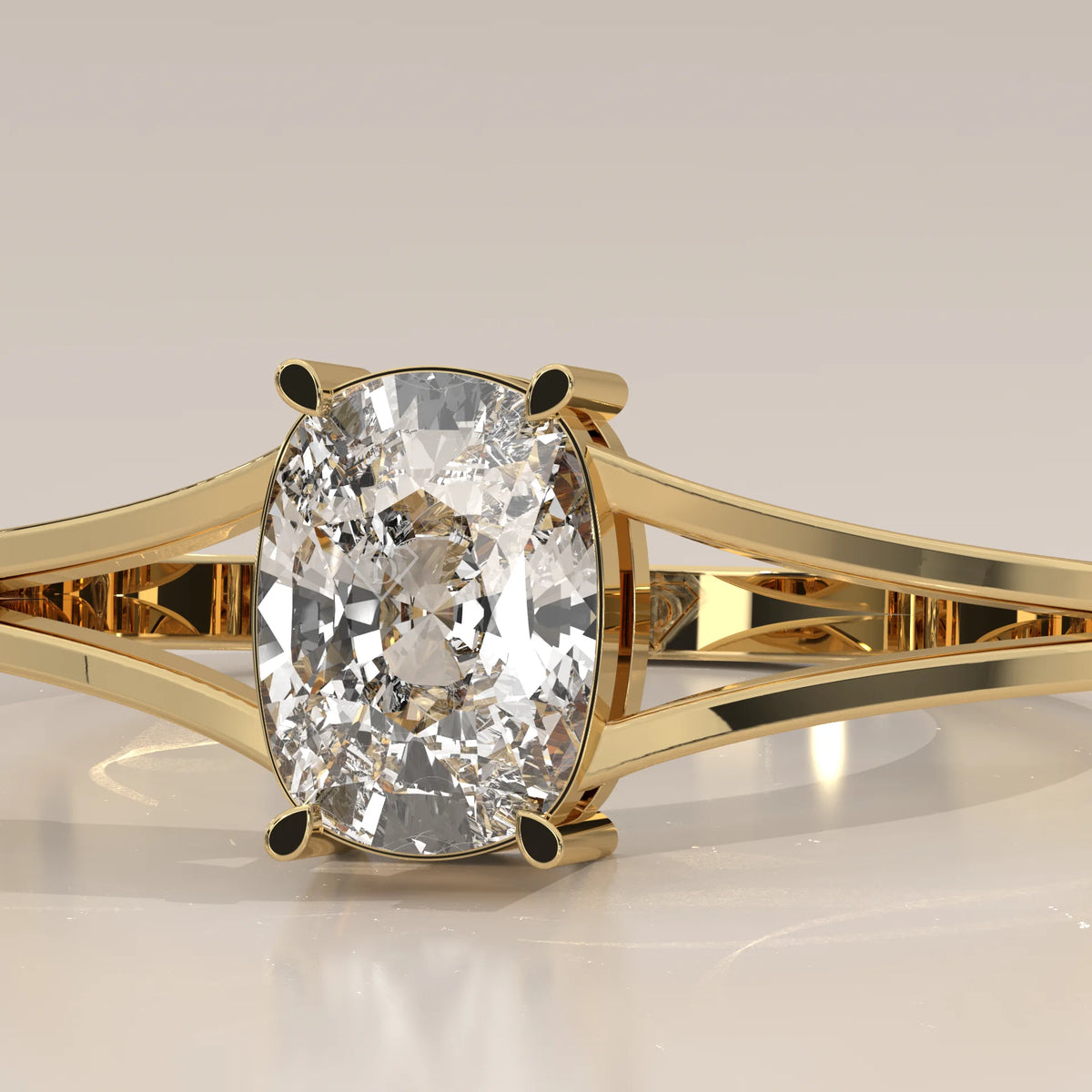 Yellow gold ring with a large cushion-cut diamond in a four-prong setting.