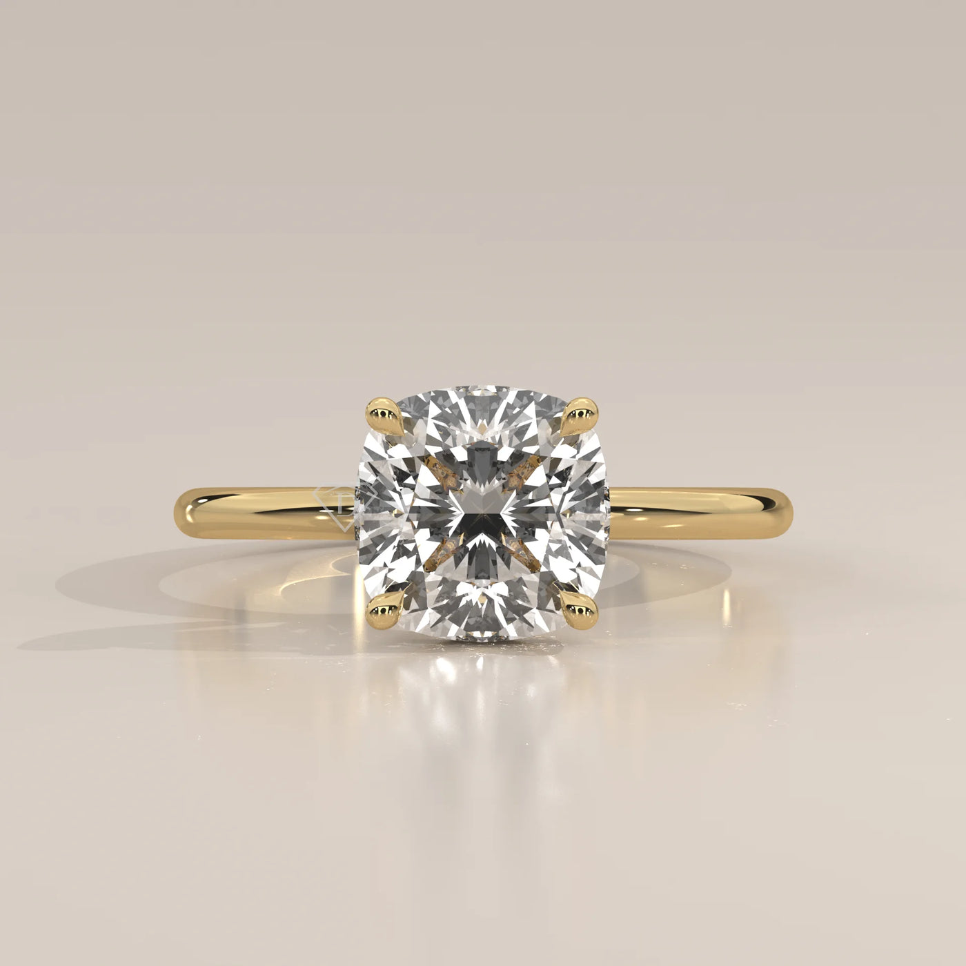 A solitaire cushion cut diamond ring in yellow gold with pav	acth band.