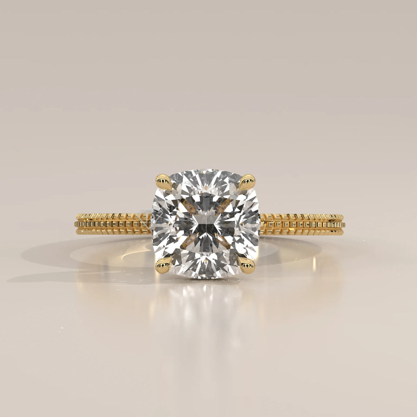 A solitaire cushion cut diamond ring in yellow gold with pav	acth band.