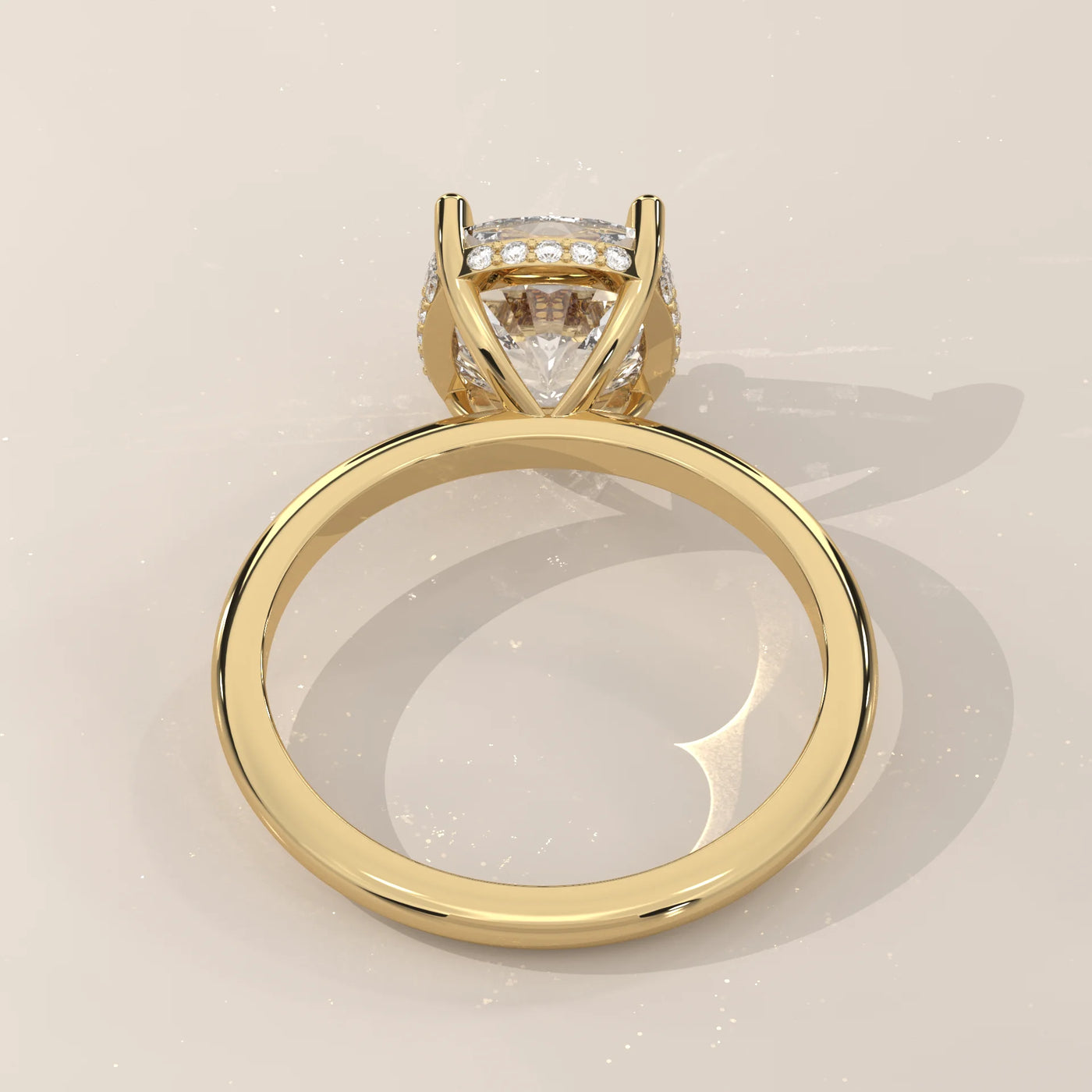 A classic yellow gold ring with a large cushion-cut diamond and halo.