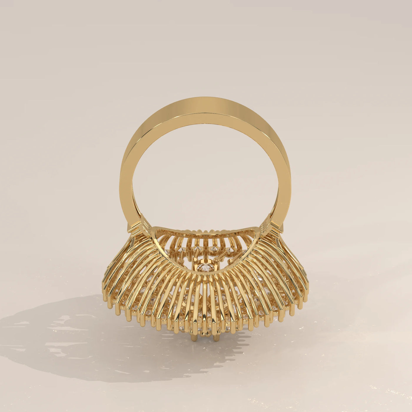 A detailed view of a gold ring with intricate stonework, seen from the back.