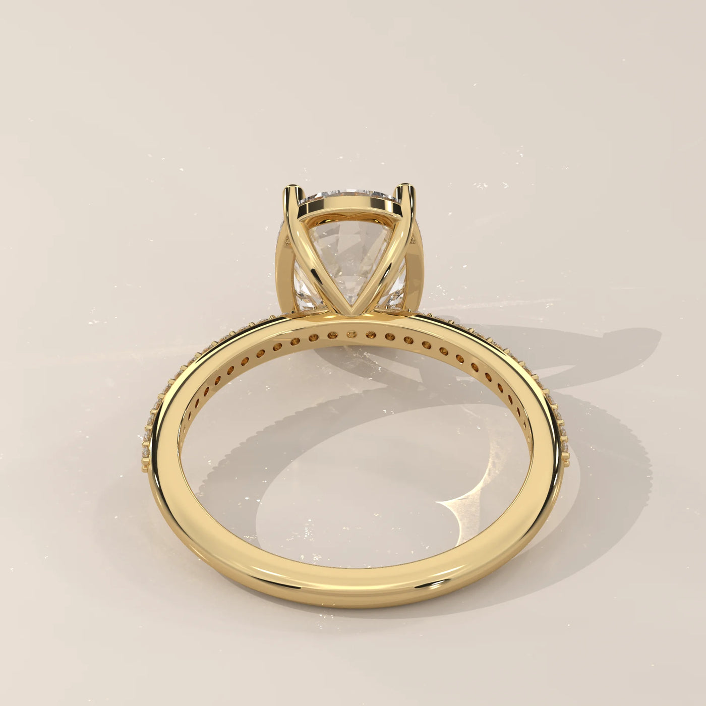 Side view of a 14k gold ring with a large diamond and diamond accents.