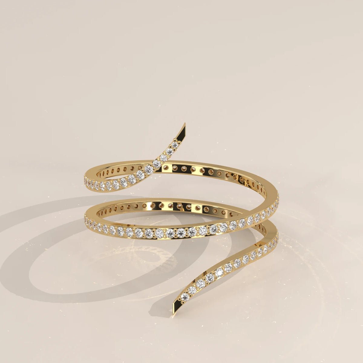 Round Lab Grown Diamond Pave Coil Ring with Tapered Pointed Ends in yellow gold, shown at an angle.