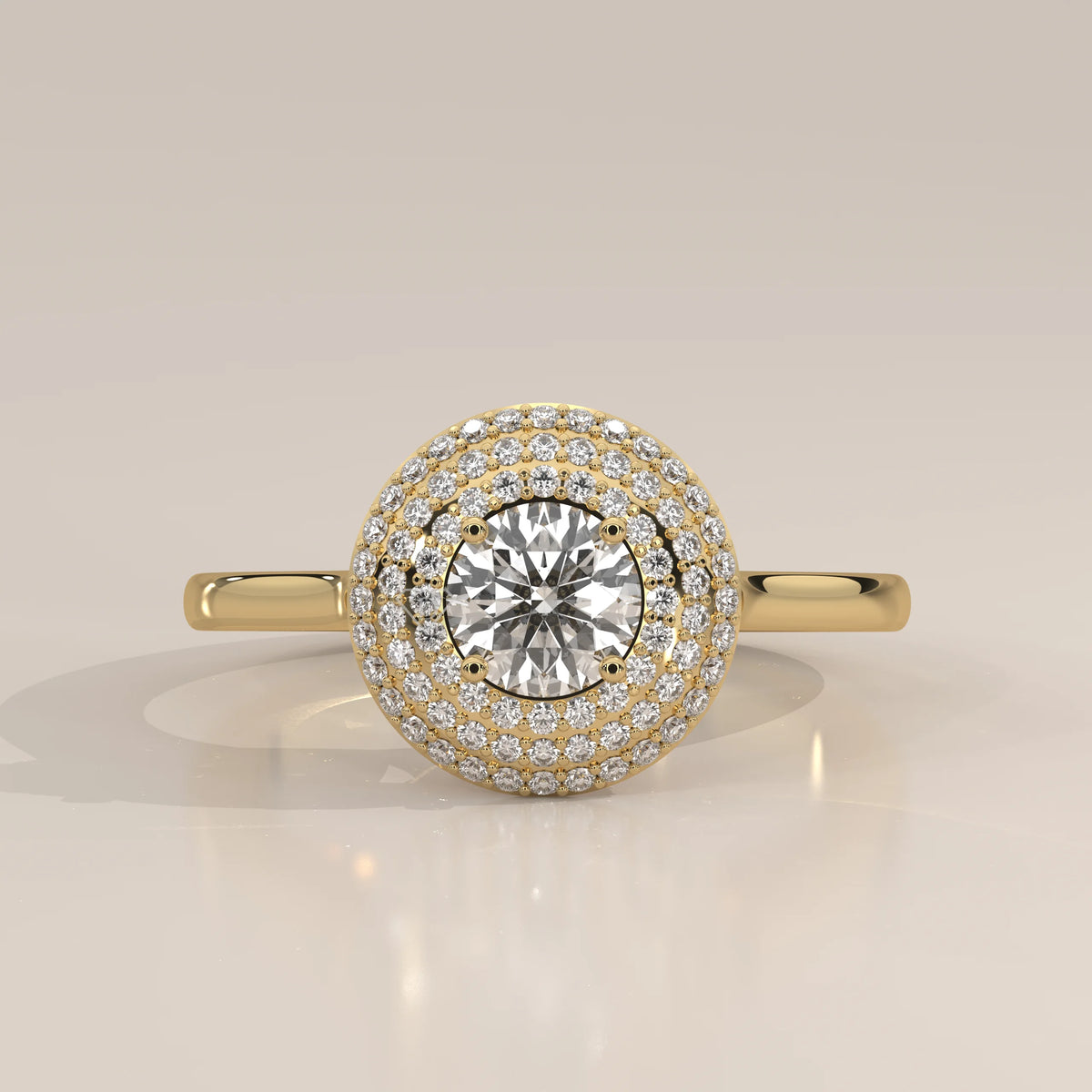 Round Lab Grown Diamond Domed Triple Halo Pave Ring in yellow gold, front view on a plain background.