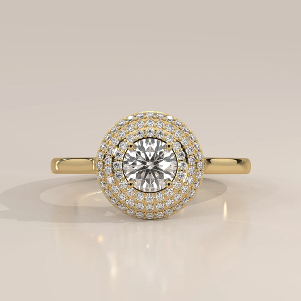 Round Lab Grown Diamond Domed Triple Halo Pave Ring in yellow gold, front view on a plain background.