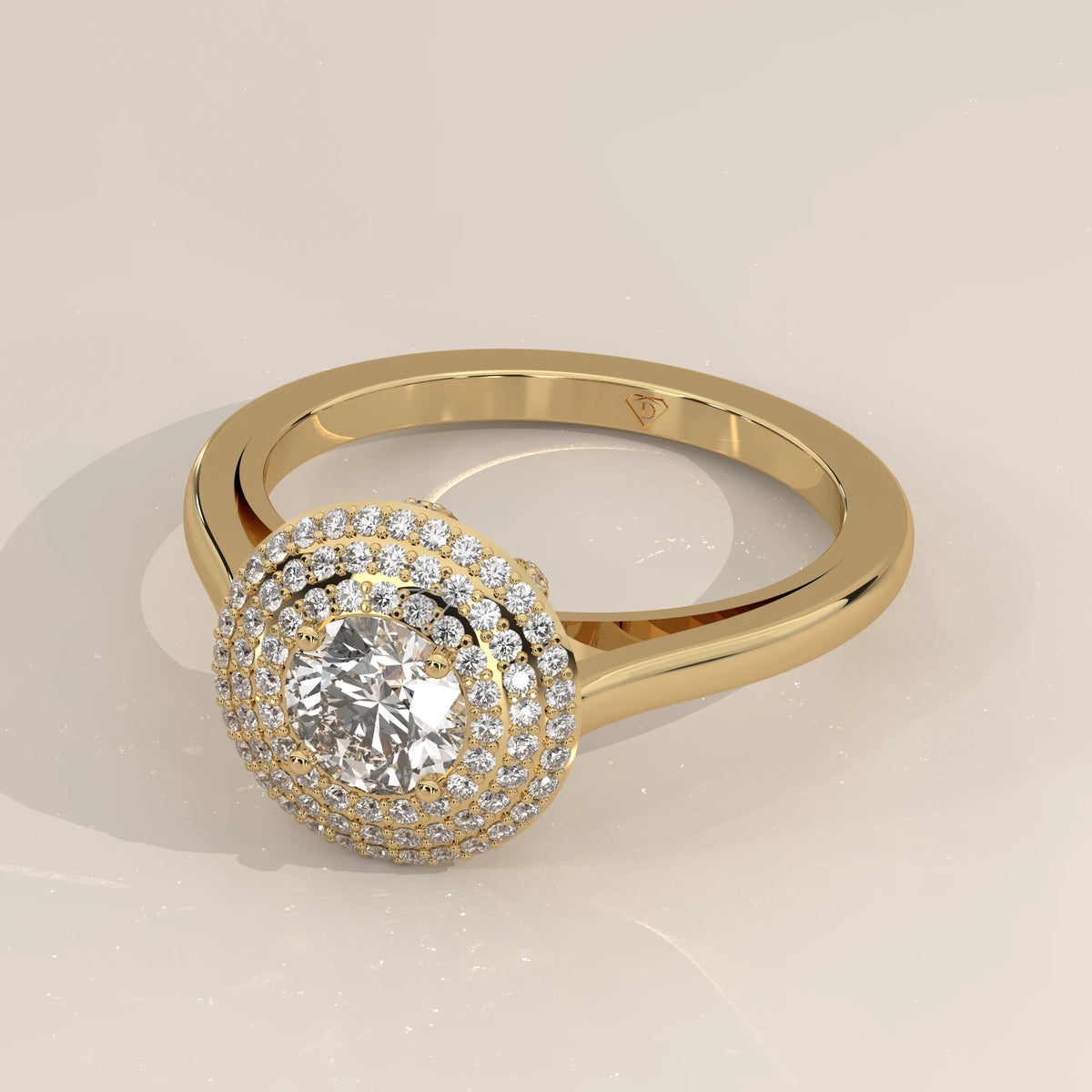 Round Lab Grown Diamond Domed Triple Halo Pave Ring in yellow gold, shown from the side.