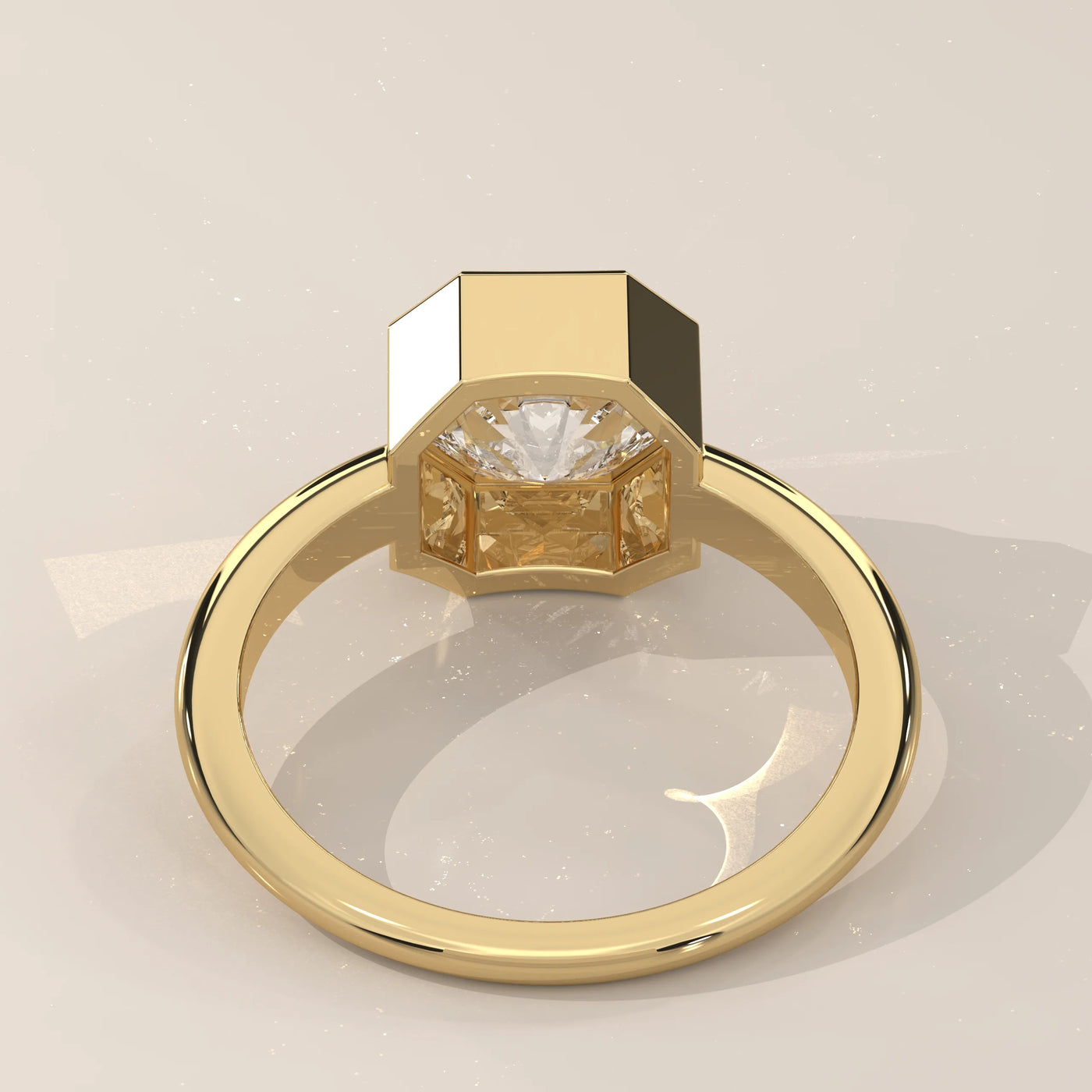 A yellow gold ring featuring a bezel-set emerald-cut diamond.