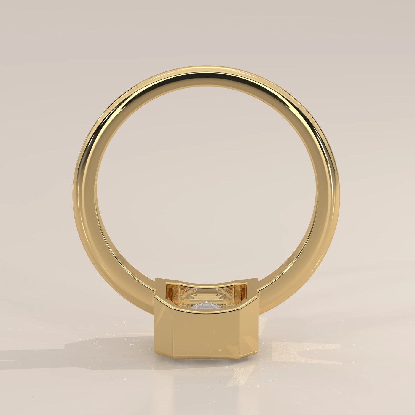 A 14k yellow gold ring with a bezeled emerald-cut diamond, shown from the back.