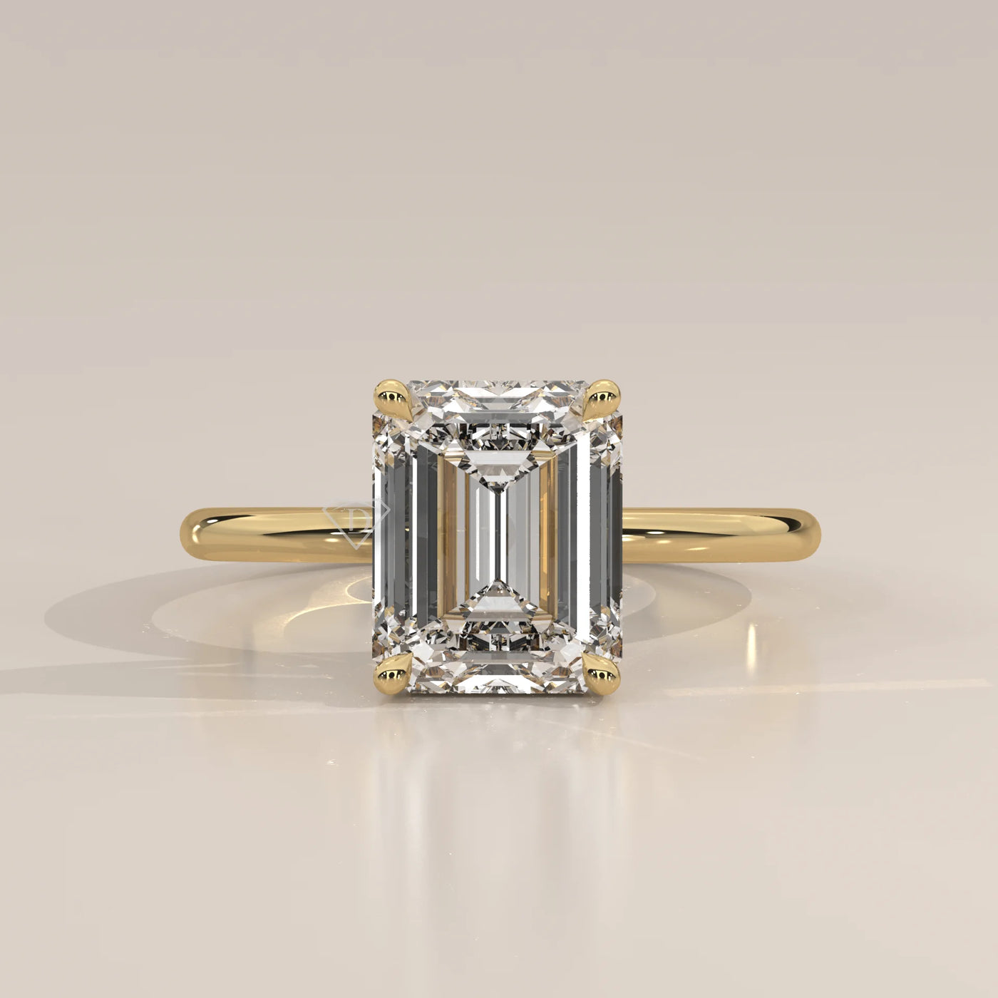 Emerald cut diamond engagement ring in 14k yellow gold.