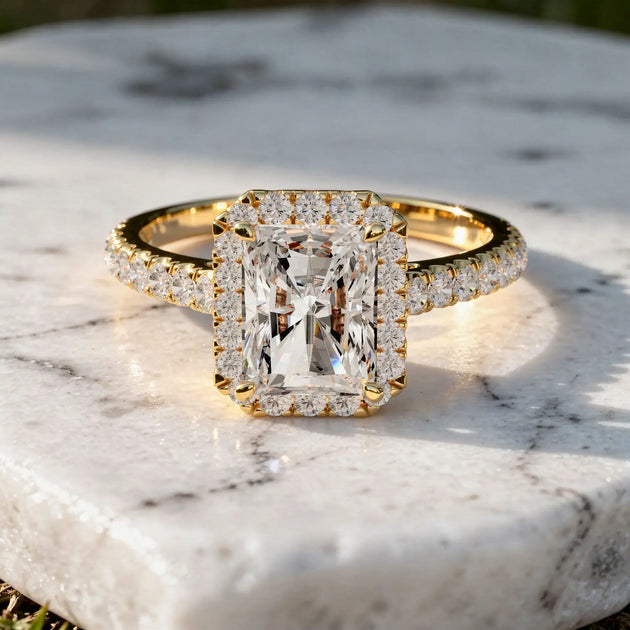 Flat Lay: Emerald Diamond Ring with Halo Setting in 14k Yellow Gold - Lab Grown - Driona Jewels
