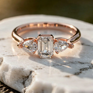 Close-up: Emerald Cut Diamond Ring with Three Stone Setting in 14k Rose Gold - Lab Grown - Driona Jewels