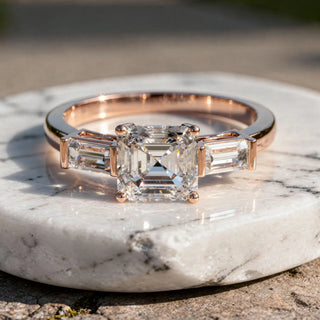 Front-view: Emerald Cut Diamond Ring with Three-Stone Setting in 14k Rose Gold - Lab Grown - Driona Jewels