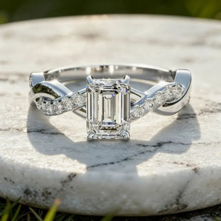 Flat Lay: Emerald Diamond Ring with Twist Setting in 14k White Gold - Lab Grown - Driona Jewels