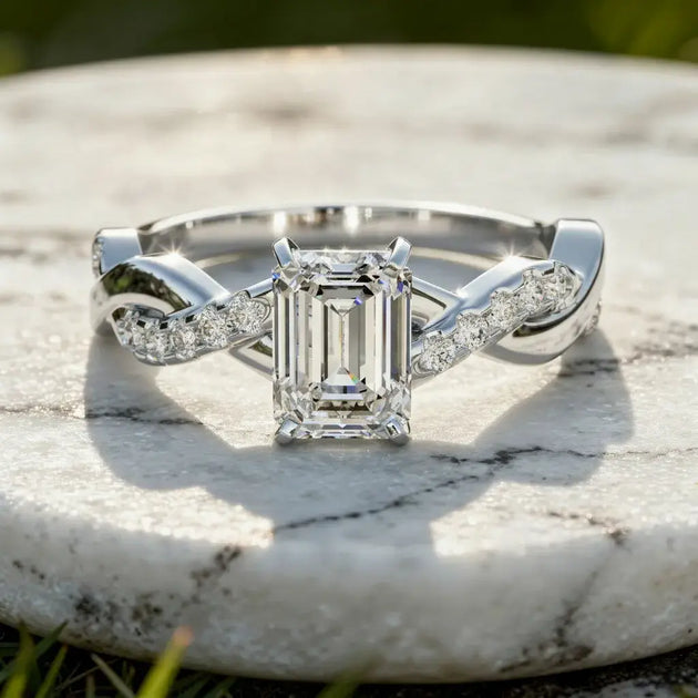 Flat Lay: Emerald Diamond Ring with Twist Setting in 14k White Gold - Lab Grown - Driona Jewels