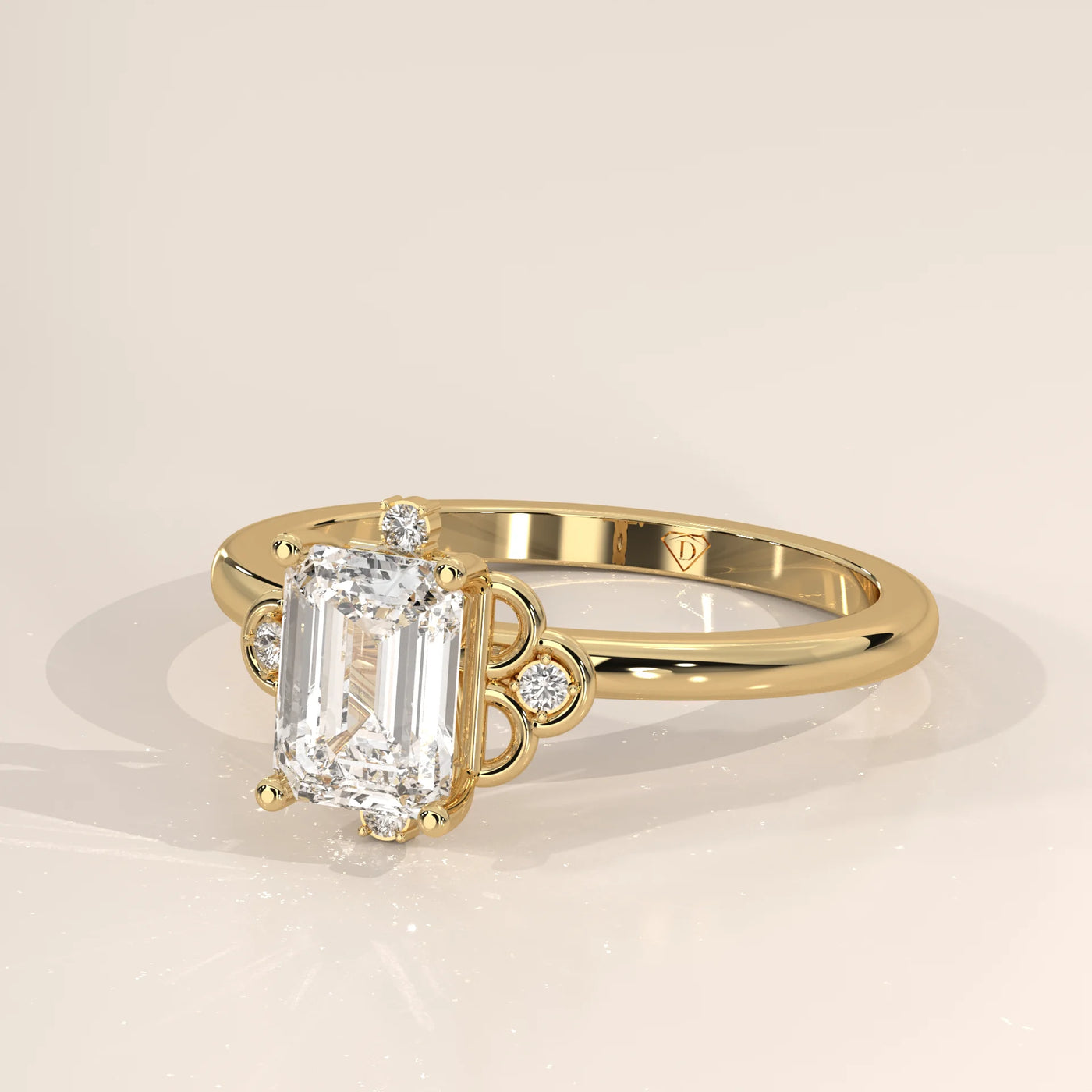 A stunning 14k yellow gold ring featuring an emerald-cut diamond at its center, accented with smaller stones.