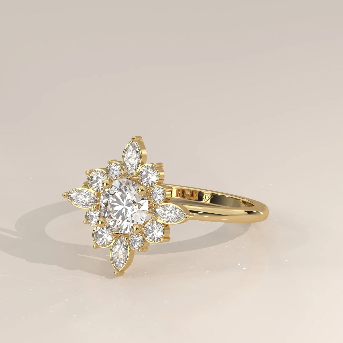 Yellow gold ring with a floral design of diamonds and pear-shaped stones.