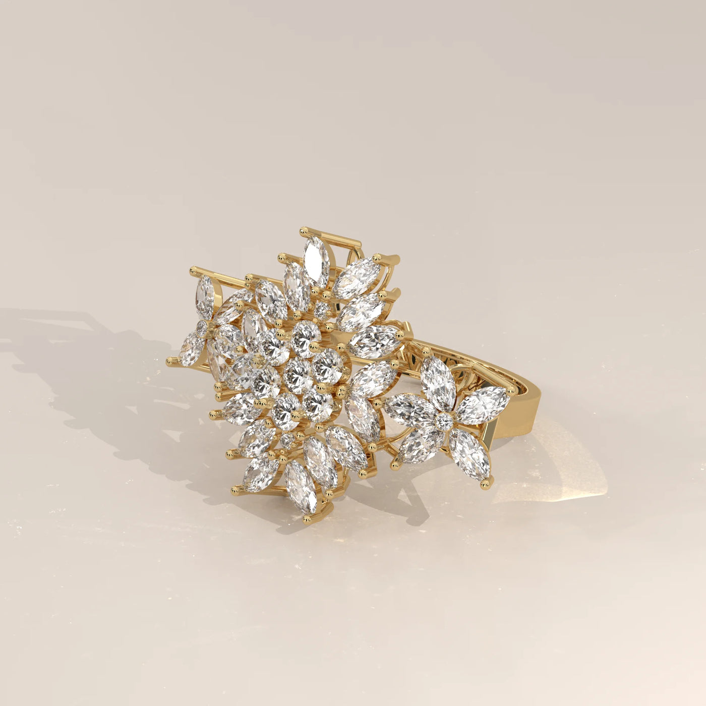 Yellow gold ring with a floral design of diamonds and pear-shaped stones.
