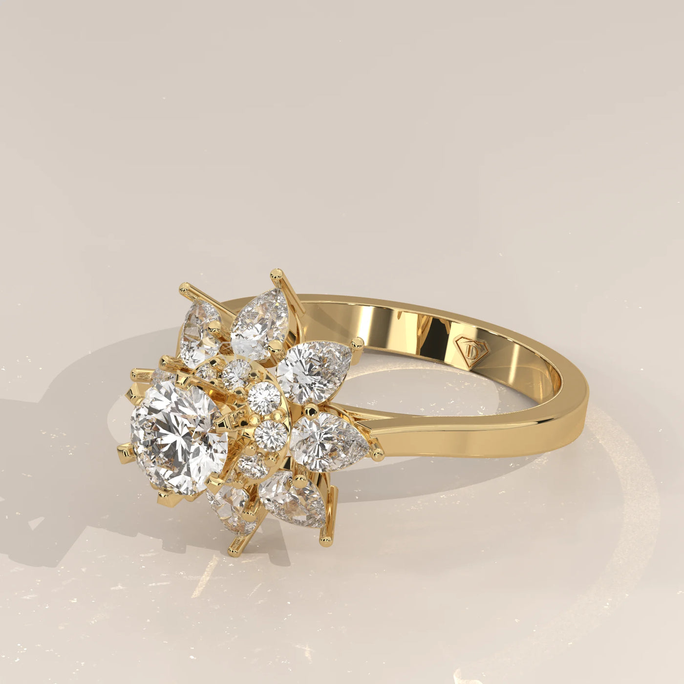 Yellow gold ring with a floral design of diamonds and pear-shaped stones.