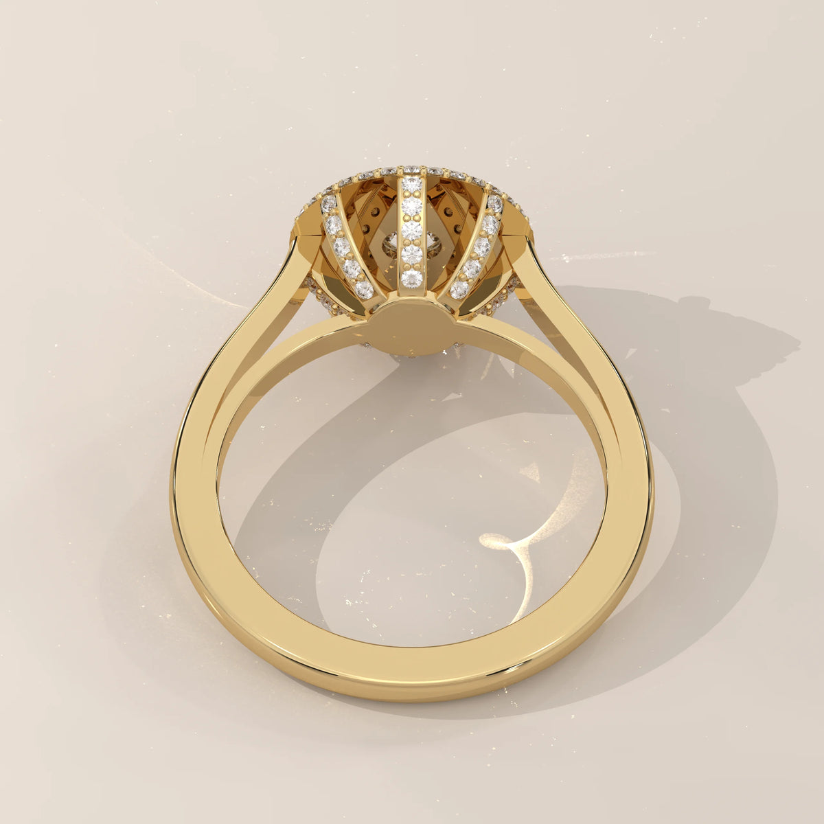 Round Lab Grown Diamond Domed Triple Halo Pave Ring in yellow gold, shown at an angle.