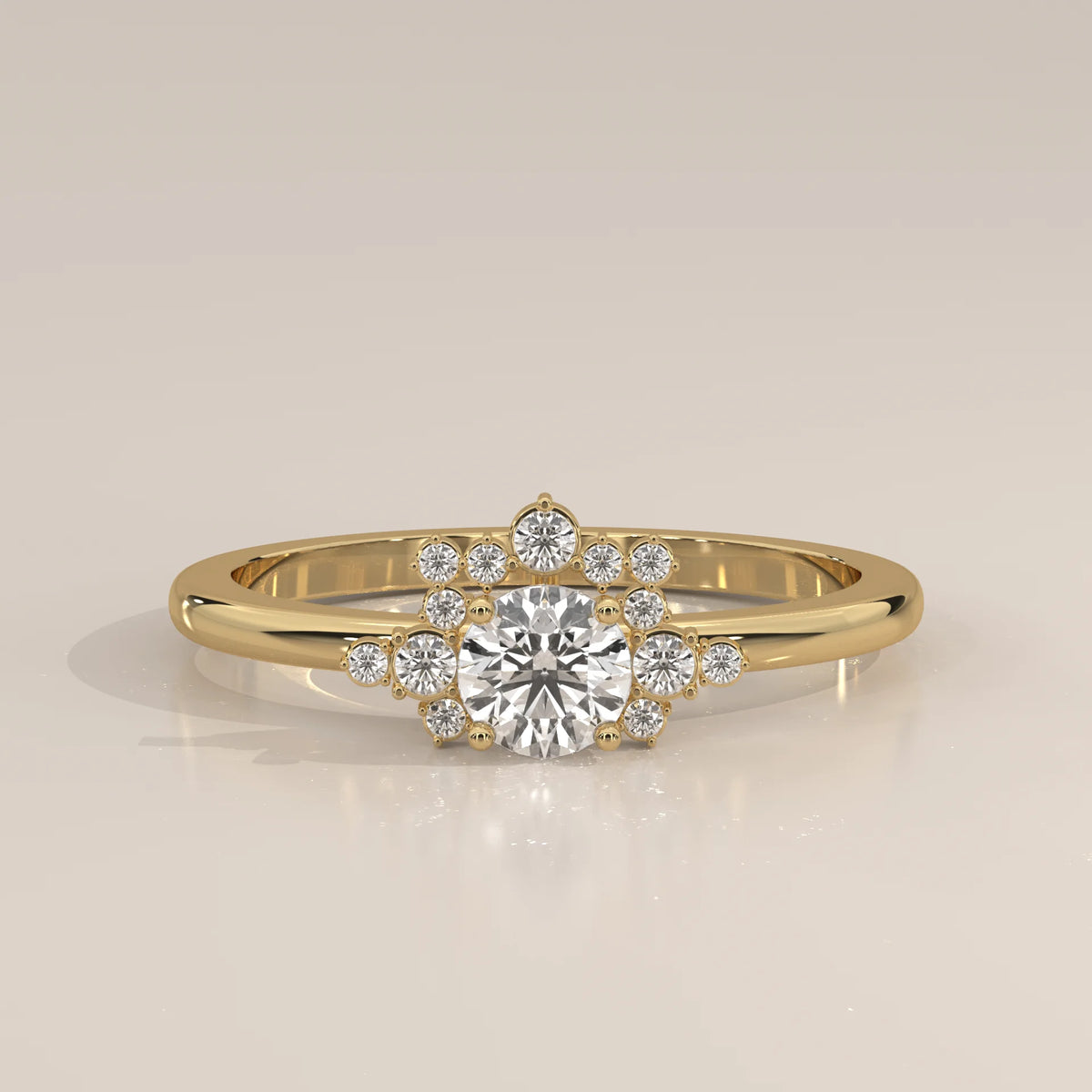 A delicate 14k yellow gold ring with a central diamond surrounded by smaller diamonds in a halo design.
