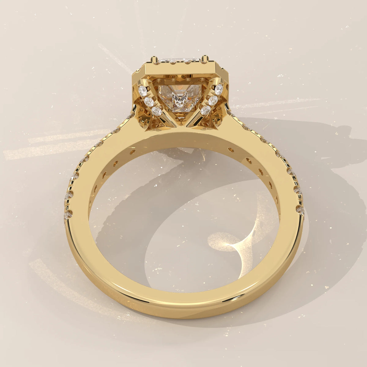 Emerald Cut Lab Grown Diamond Halo Ring with Pave Shank in yellow gold, shown at an angle.
