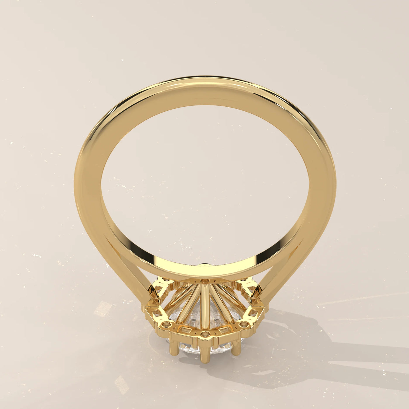 A yellow gold ring with a halo of diamonds, viewed from the back.