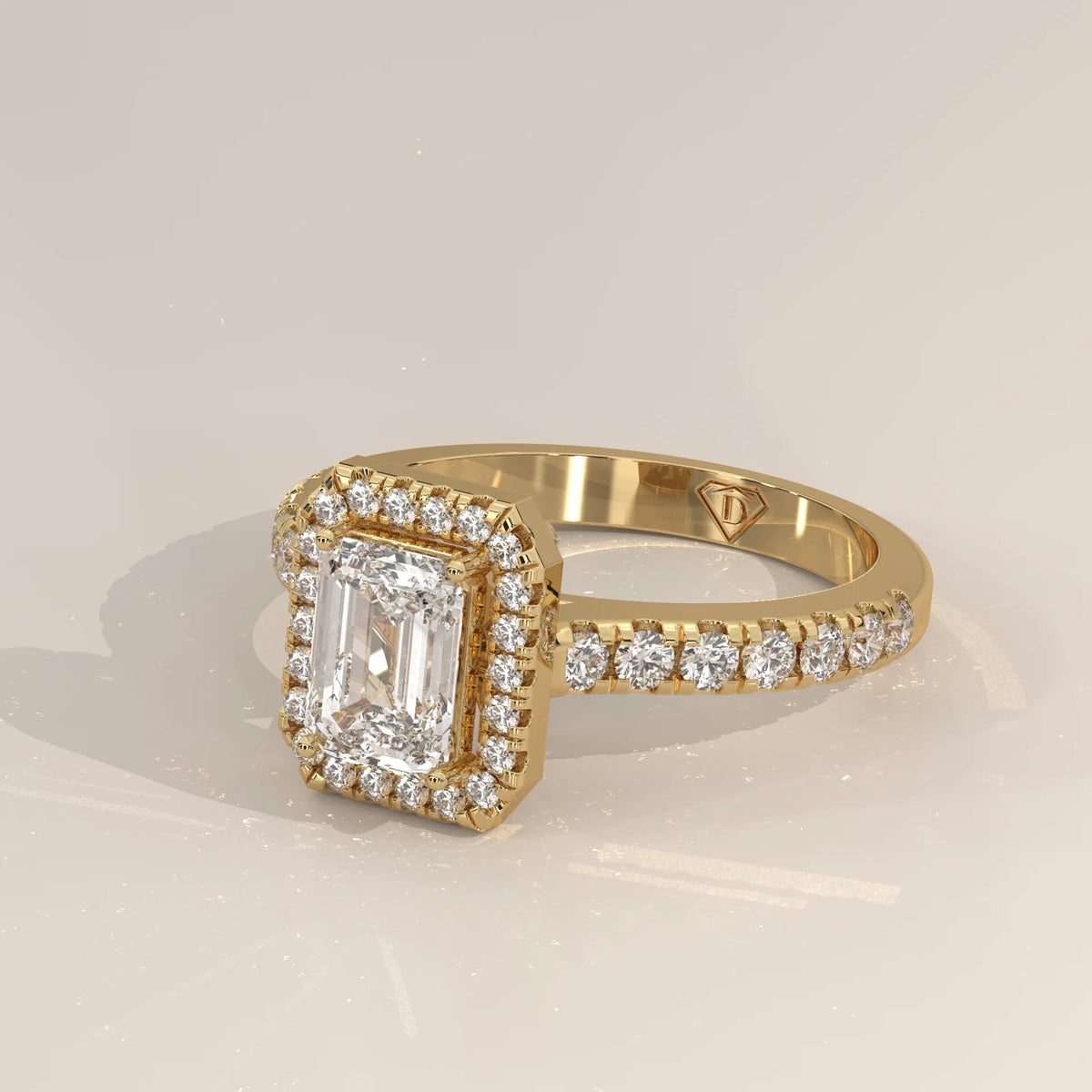 Emerald Cut Lab Grown Diamond Halo Ring with Pave Shank in yellow gold, shown from the side.