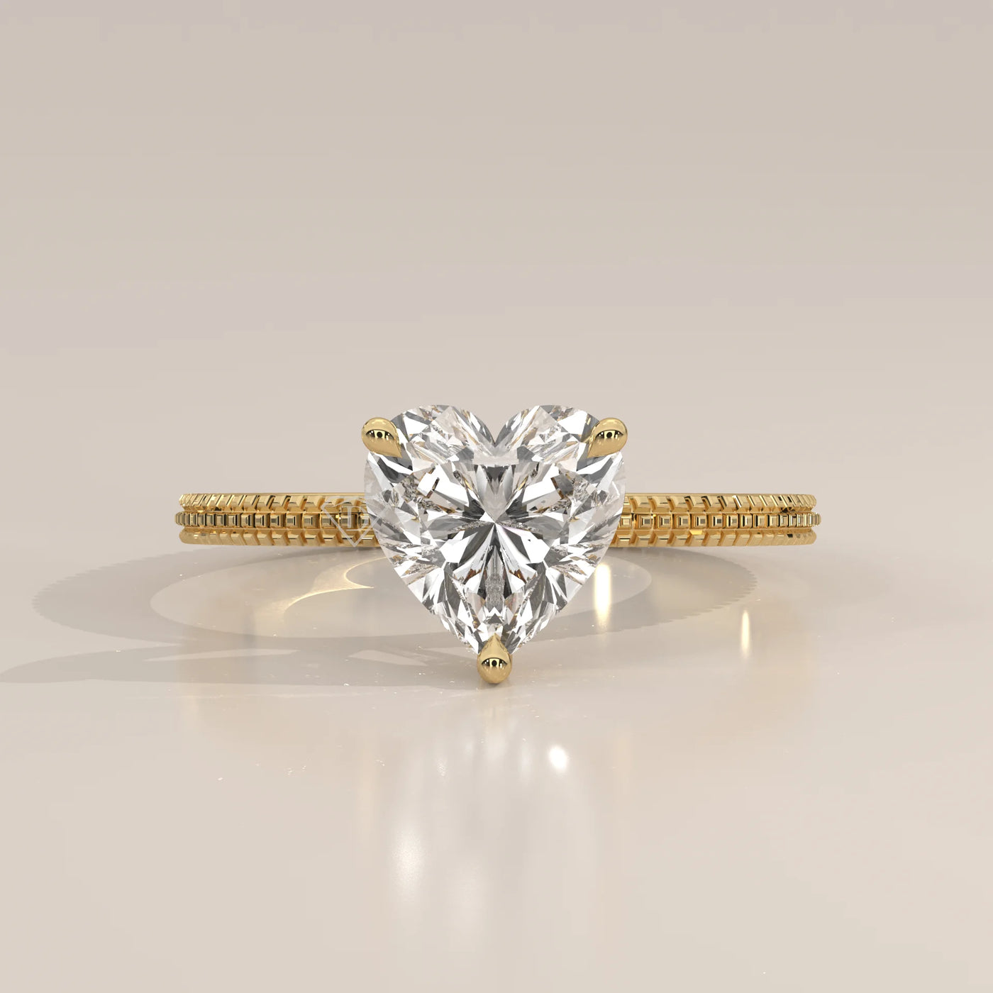 A yellow gold ring with a heart-shaped diamond in a bezel setting.