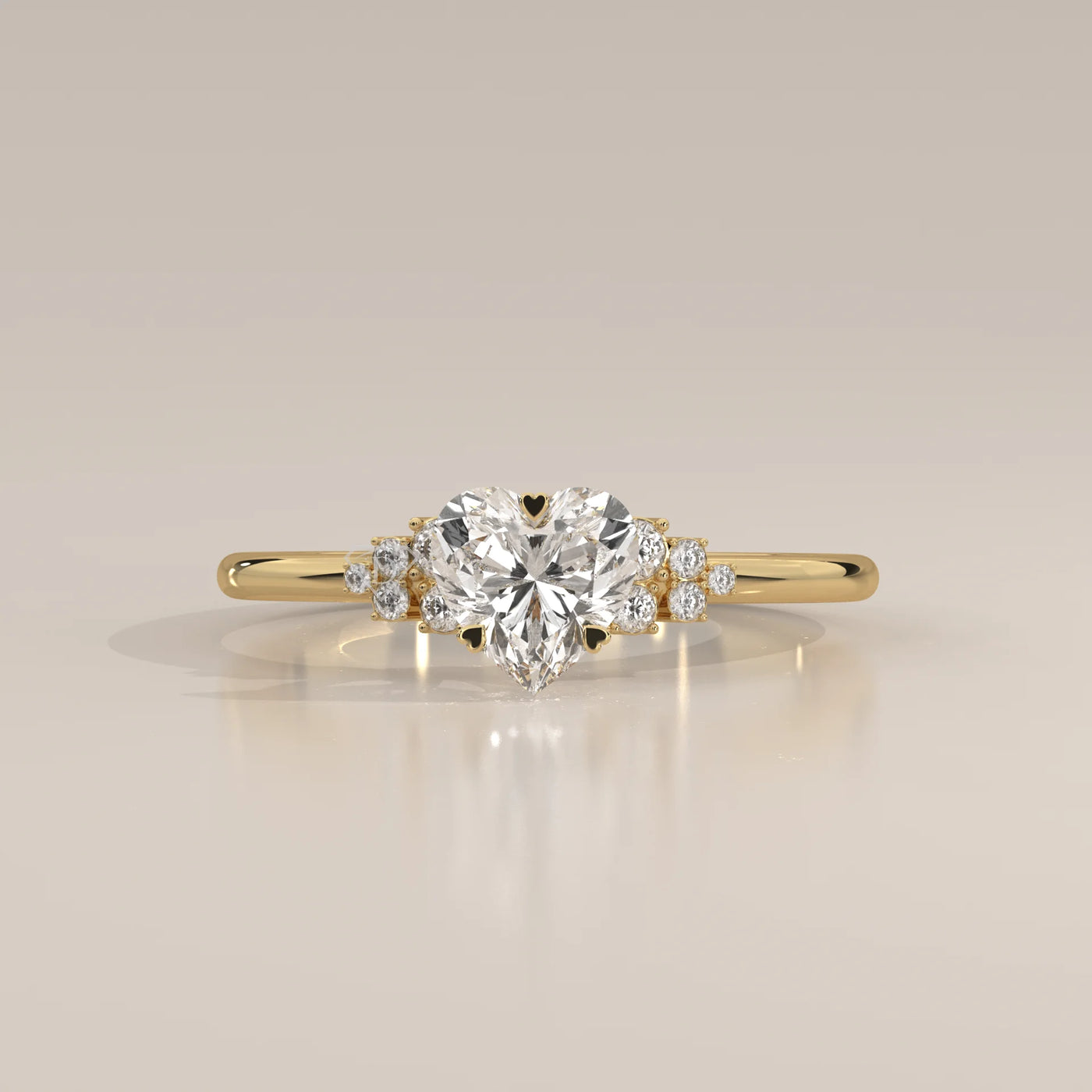 Gold ring with a heart-shaped diamond and smaller stones.