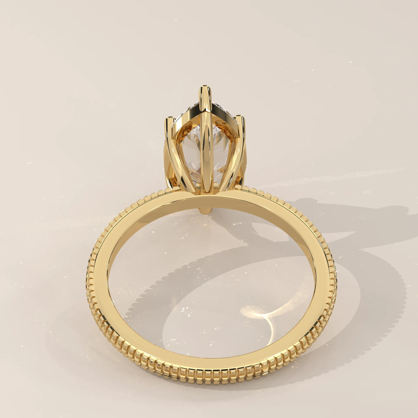 A 14k gold ring with a large marquise-cut diamond in a raised setting.