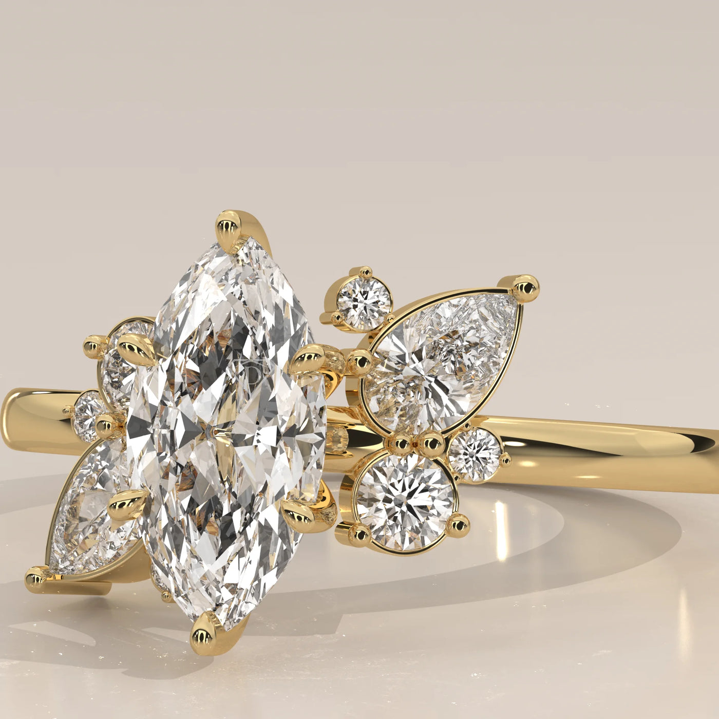 Gold ring with a marquise-cut diamond and side stones.