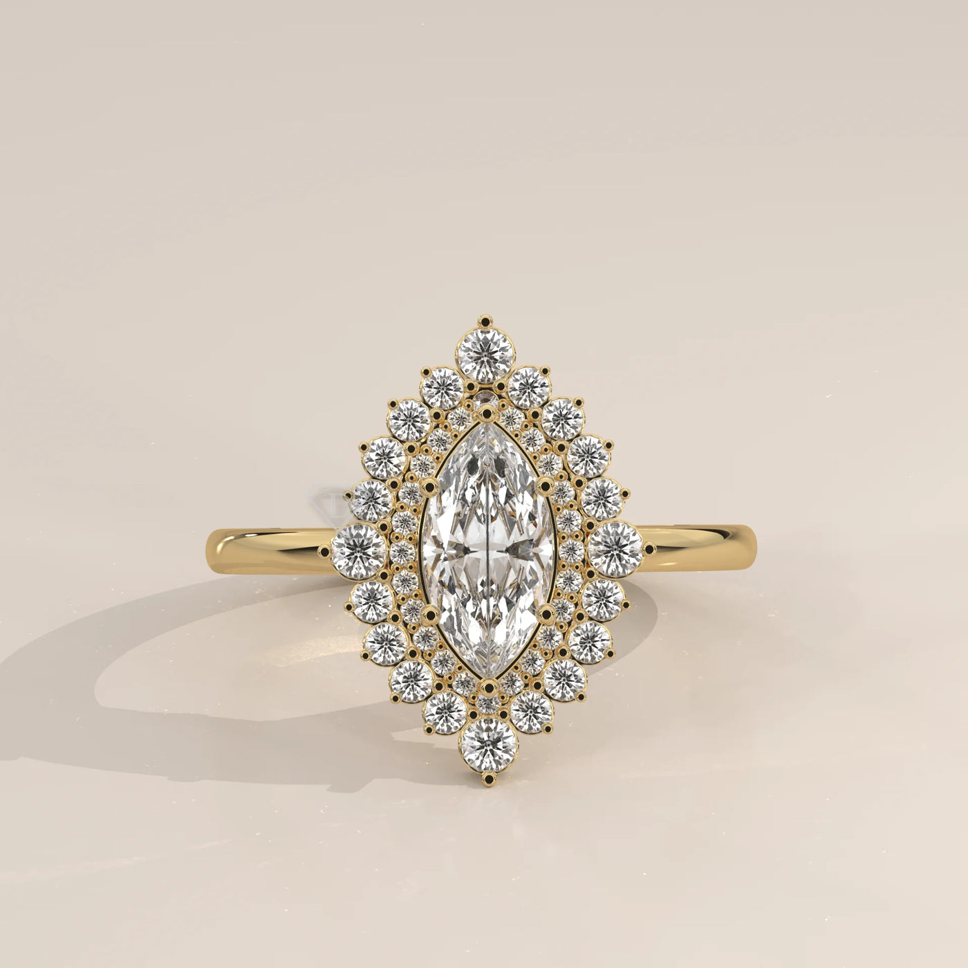 Yellow gold marquise diamond engagement ring with a halo of small diamonds.