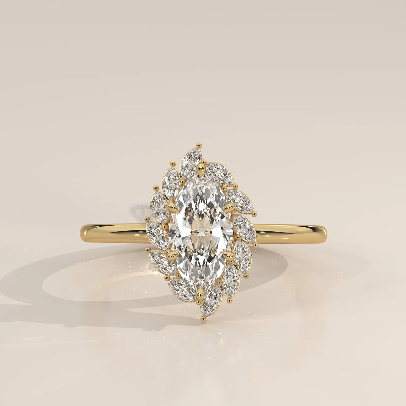 Yellow gold engagement ring with a central marquise diamond surrounded by smaller diamonds.