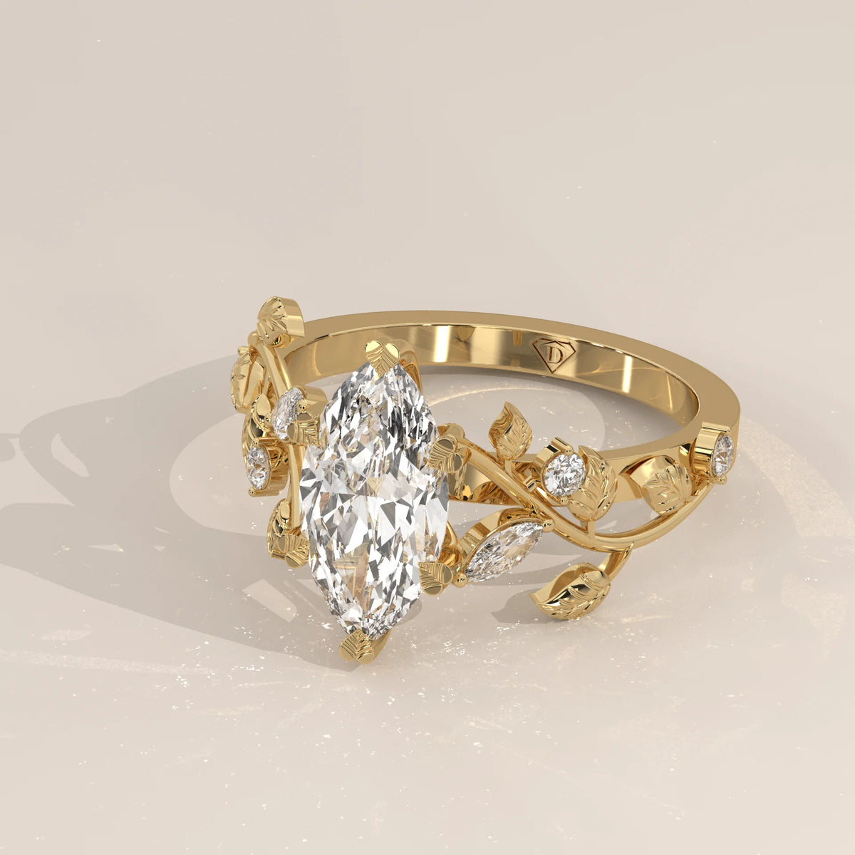 Marquise Lab Grown Diamond Vine Ring with Engraved Leaves in yellow gold, shown at an angle.