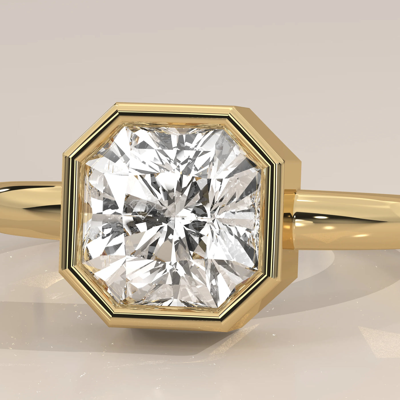 Close-up of a classic octagon-shaped diamond set in a yellow gold ring.