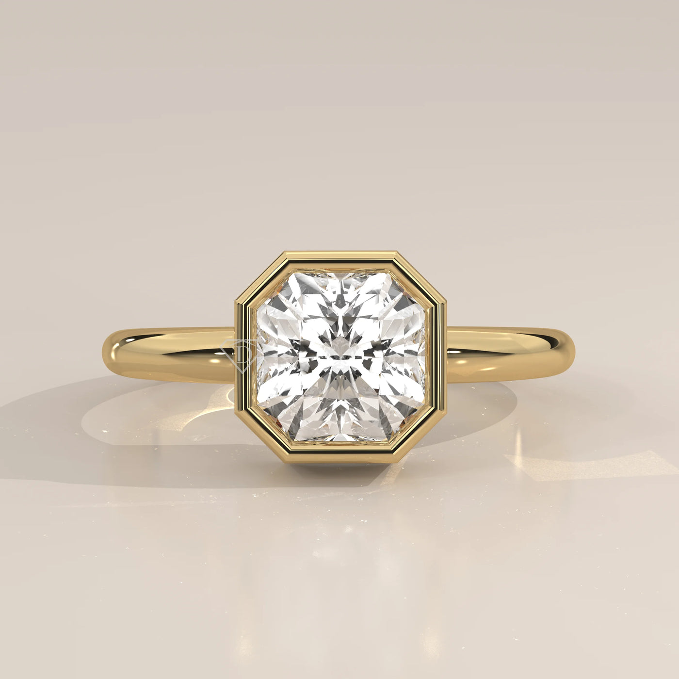 A yellow gold ring with an octagon-shaped diamond in a bezel setting.