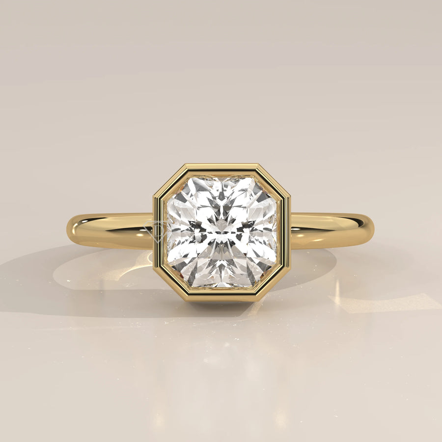 A yellow gold ring with an octagon-shaped diamond in a bezel setting.
