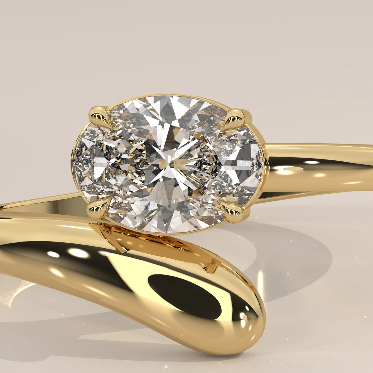East West Oval Lab Grown Diamond Bypass Ring with Teardrop End in yellow gold, shown in close-up.