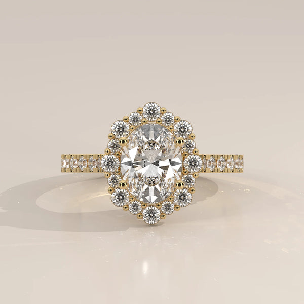 Oval Lab Grown Diamond Cluster Halo Ring with Pave Band in yellow gold, photographed head-on.
