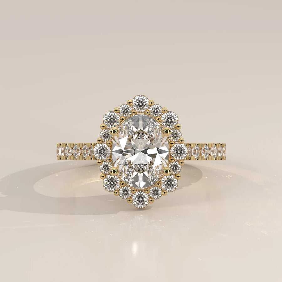 Oval Lab Grown Diamond Cluster Halo Ring with Pave Band in yellow gold, photographed head-on.