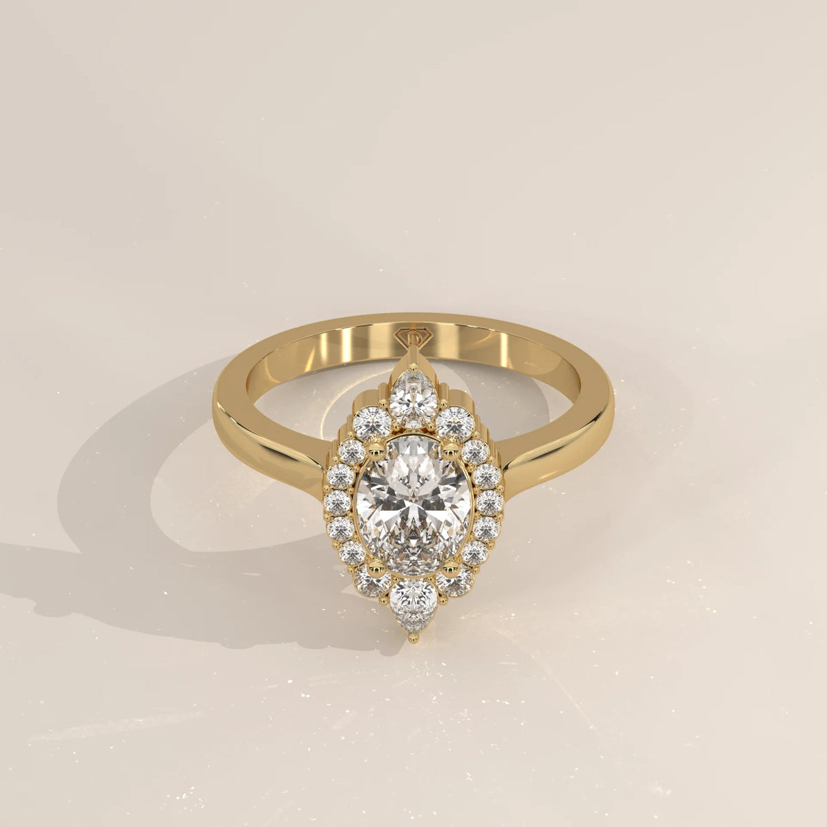 Oval Lab Grown Diamond Halo Ring with Pear Tips at Top and Base in yellow gold, shown at an angle.