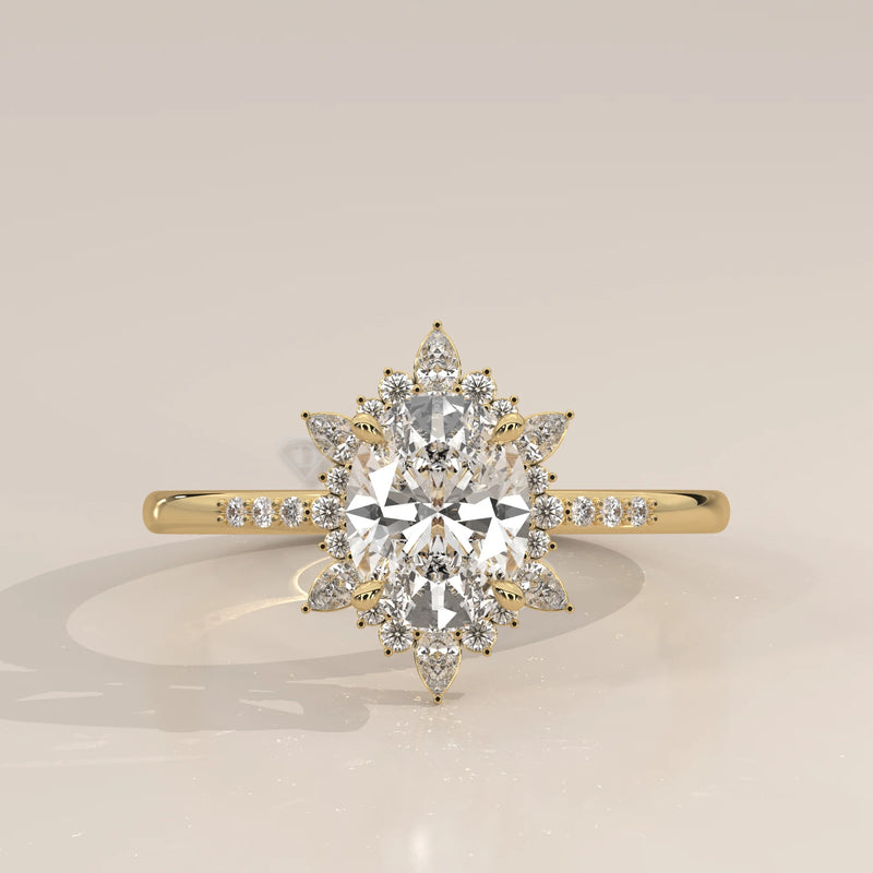 Yellow gold engagement ring with an oval diamond and a sunburst halo.